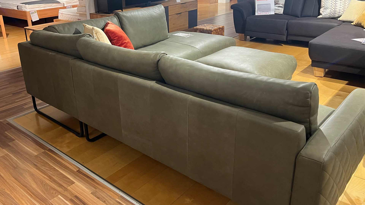 Sofa-zum-abverkauf-gruen-leder-reduzie