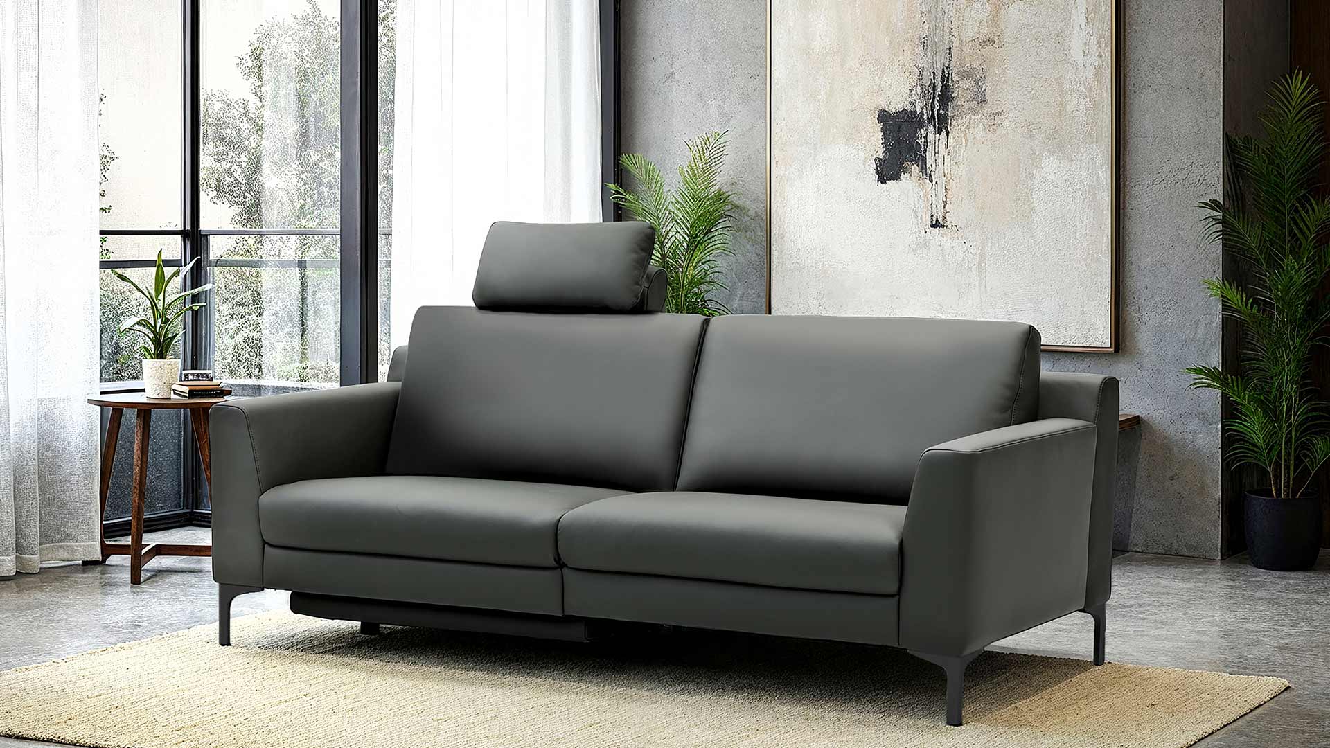 Modernes Relaxsofa mit Metallfüßen in schwarzem Leder.