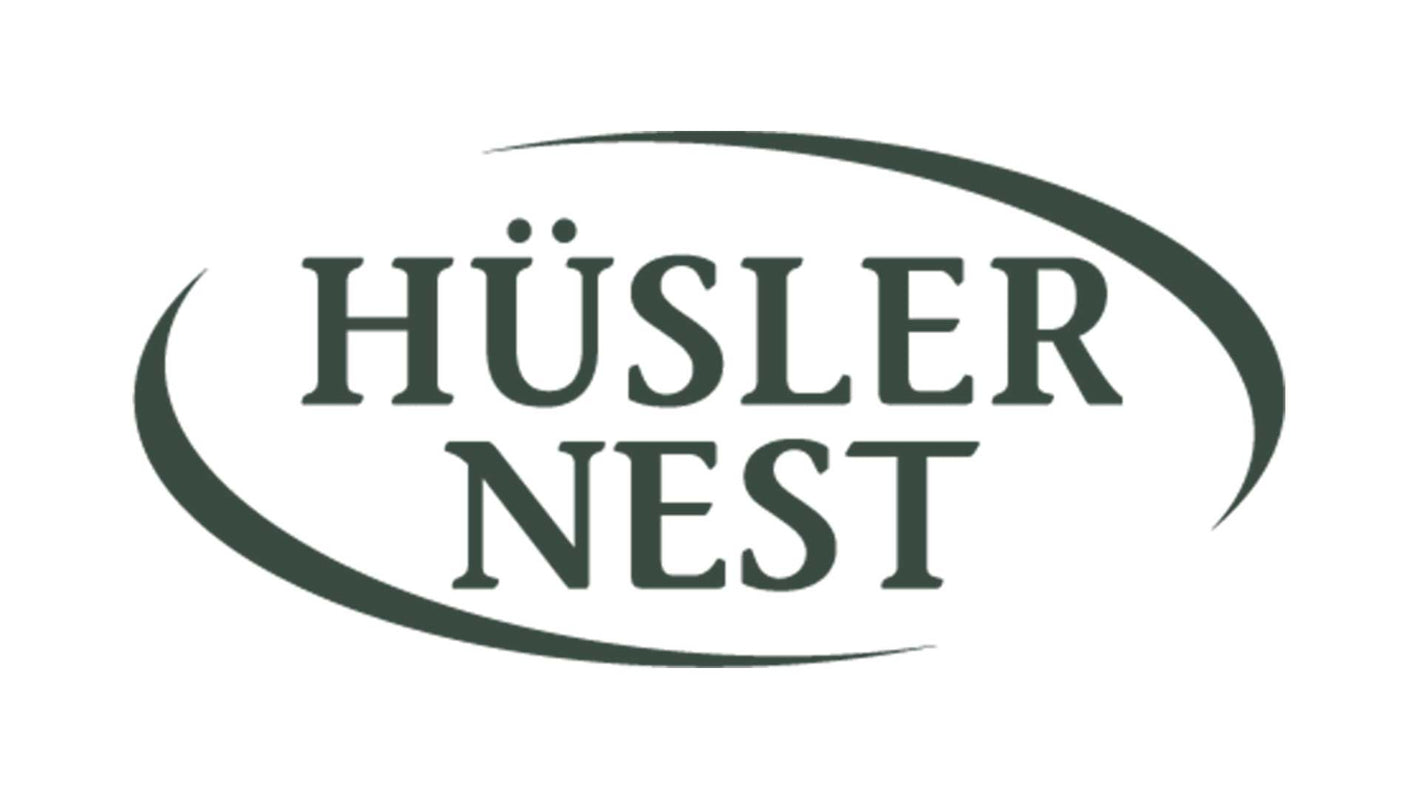 Logo von Hüsler Nest in grün.