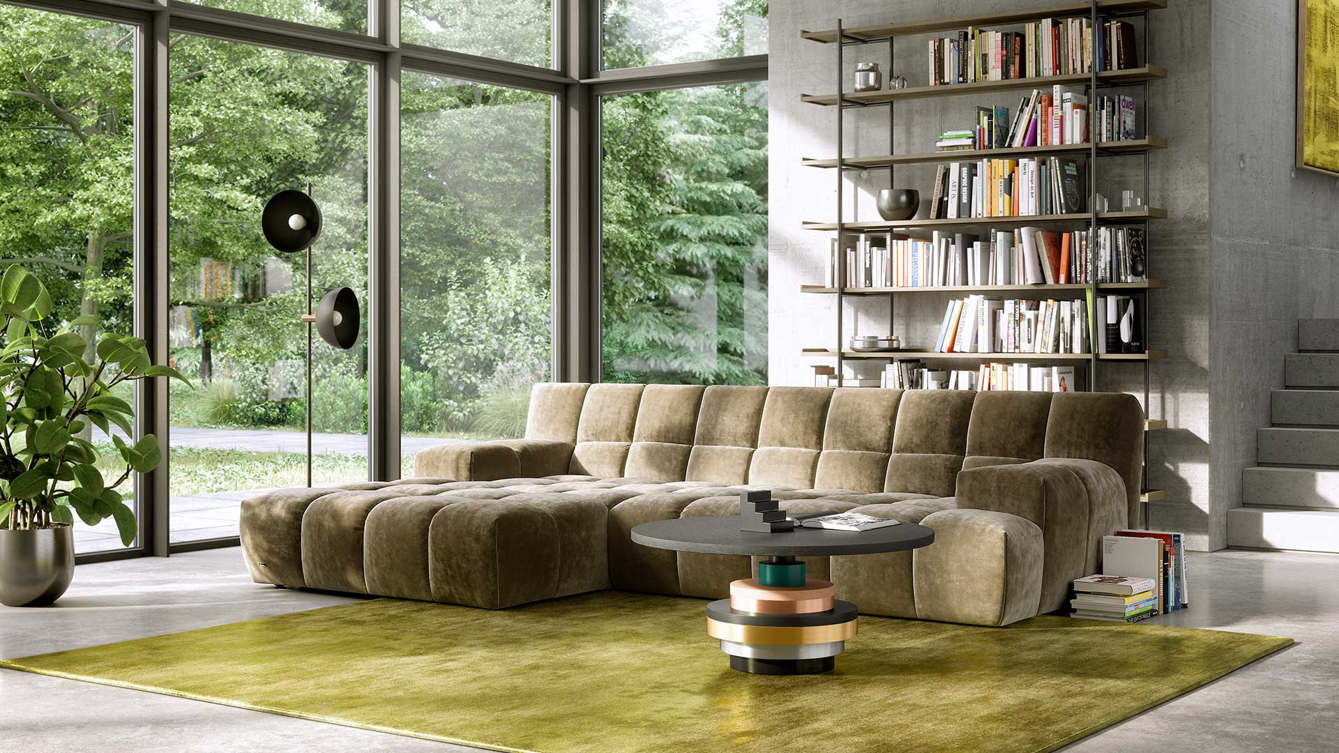 Wohnzimmer in Betonoptik mit der Bretz Cloud 7 Couch in olivfarbendem Velours gepolstert.