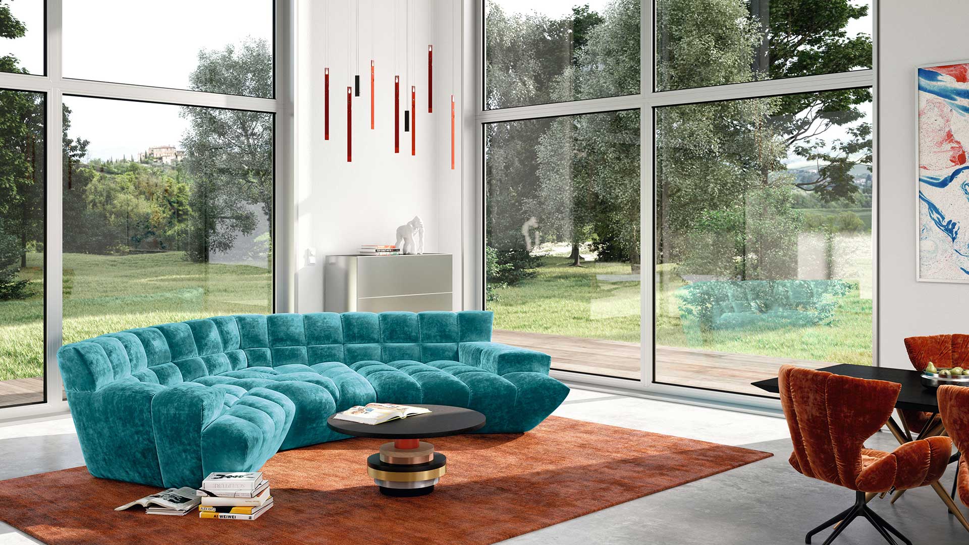 Bretz Cloud 7 Sofa in türkisem Velours auf orangem Teppich in einem modernen Wohnzimmer mit Fensterfront.