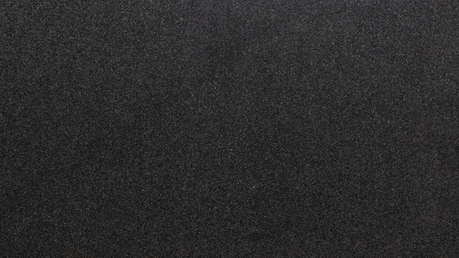 Naturstein Küchenarbeitsplatte mit schwarzer Grundfarbe in poliert oder matt mit feinen weißen Sprenklern wie ein Sternenhimmel in dunkler Nacht in der Farbe Nero Africa Impala.