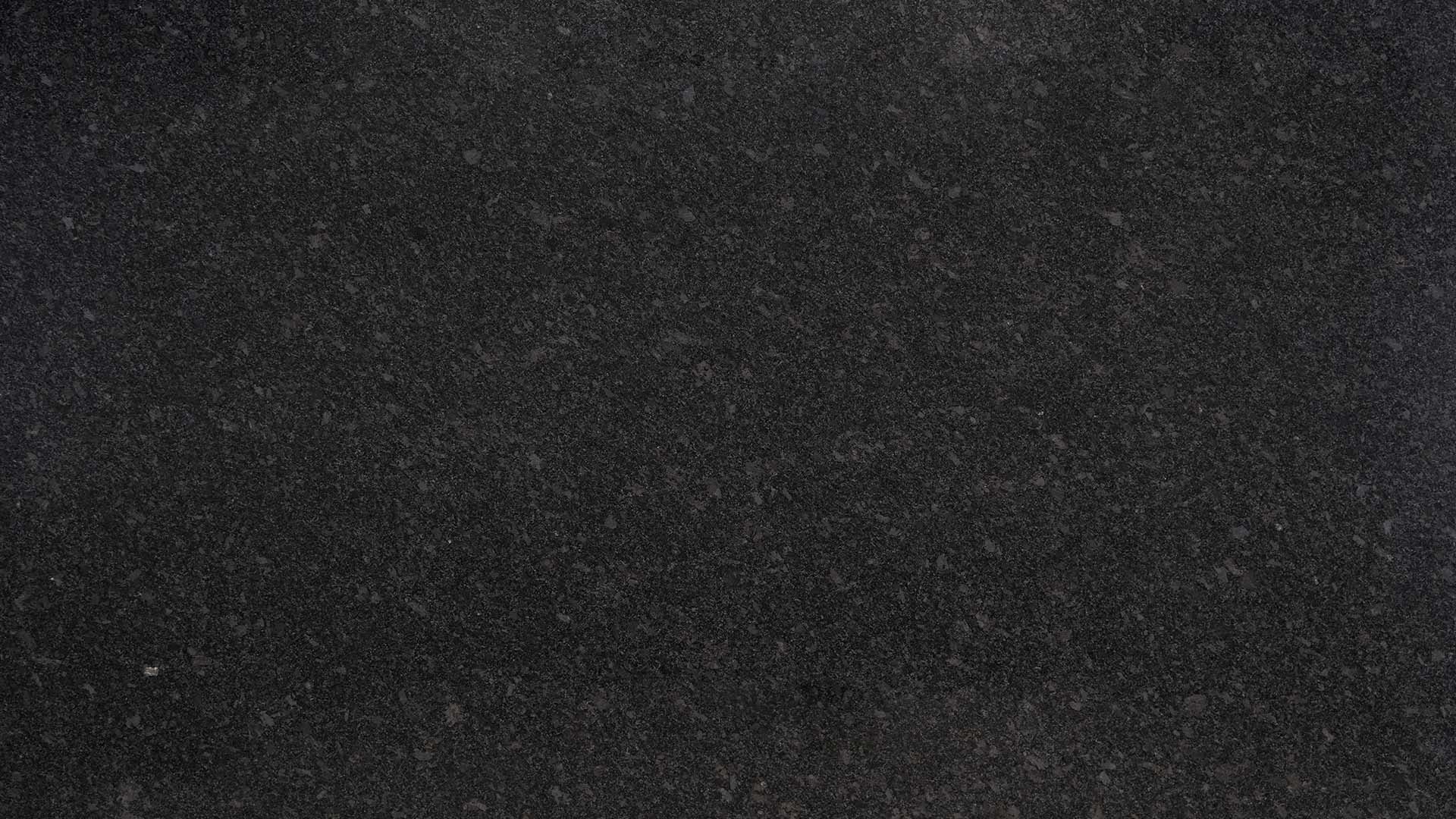 Naturstein Küchenarbeitsplatte poliert in der Grundfarbe schwarz mit silber-grauen Einsätzen wie Regenperlen in der Farbe Silver Pearl.